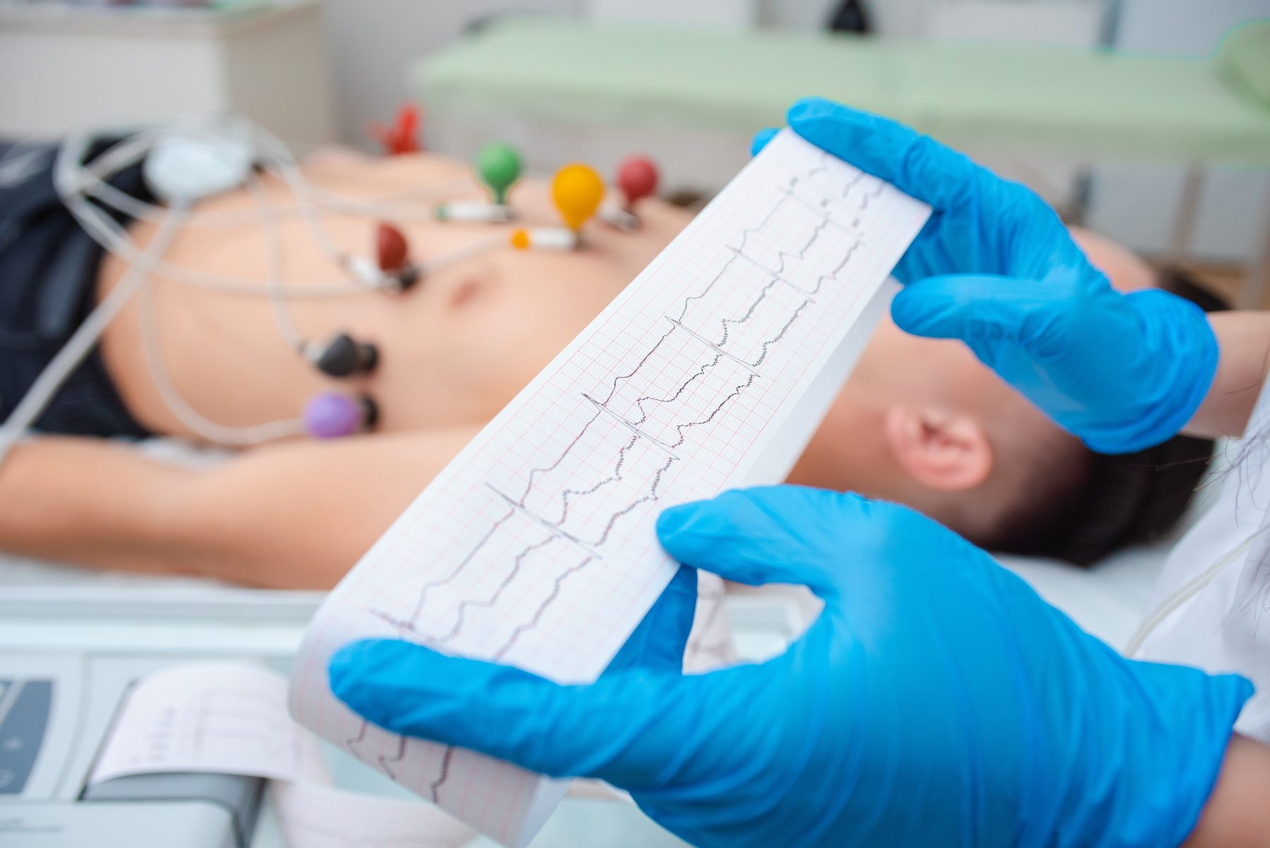 EKG tracing being reviewed